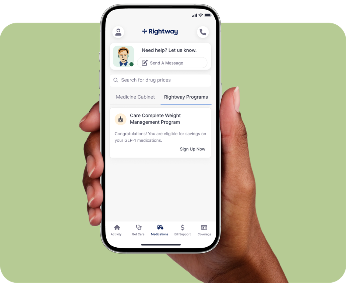 hand holding phone on green background