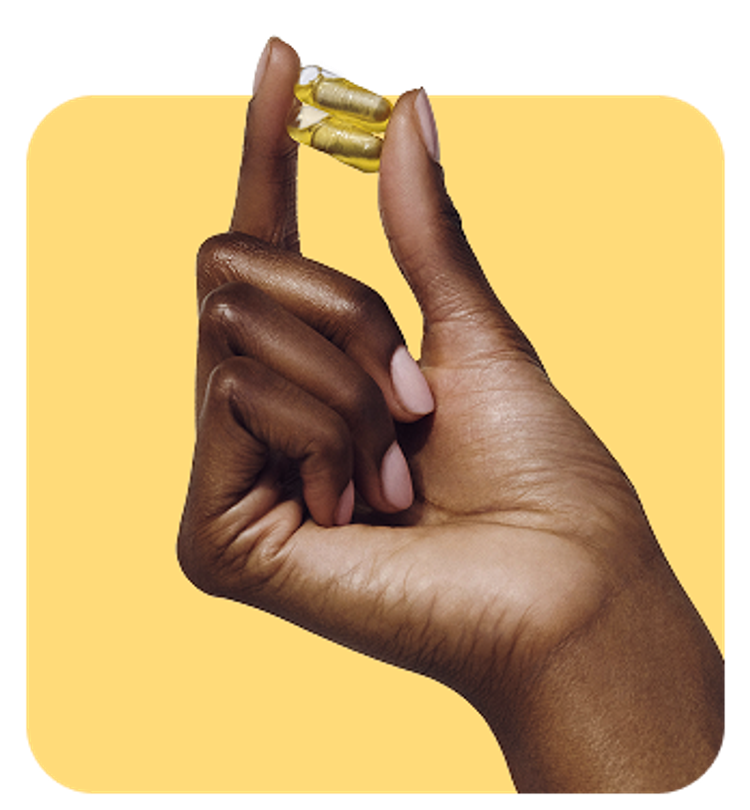 Hand holding pills