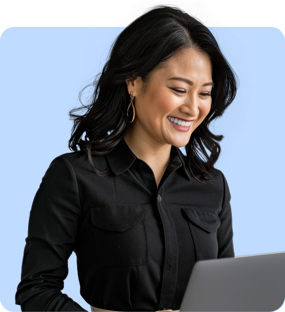 smiling lady looking at laptop