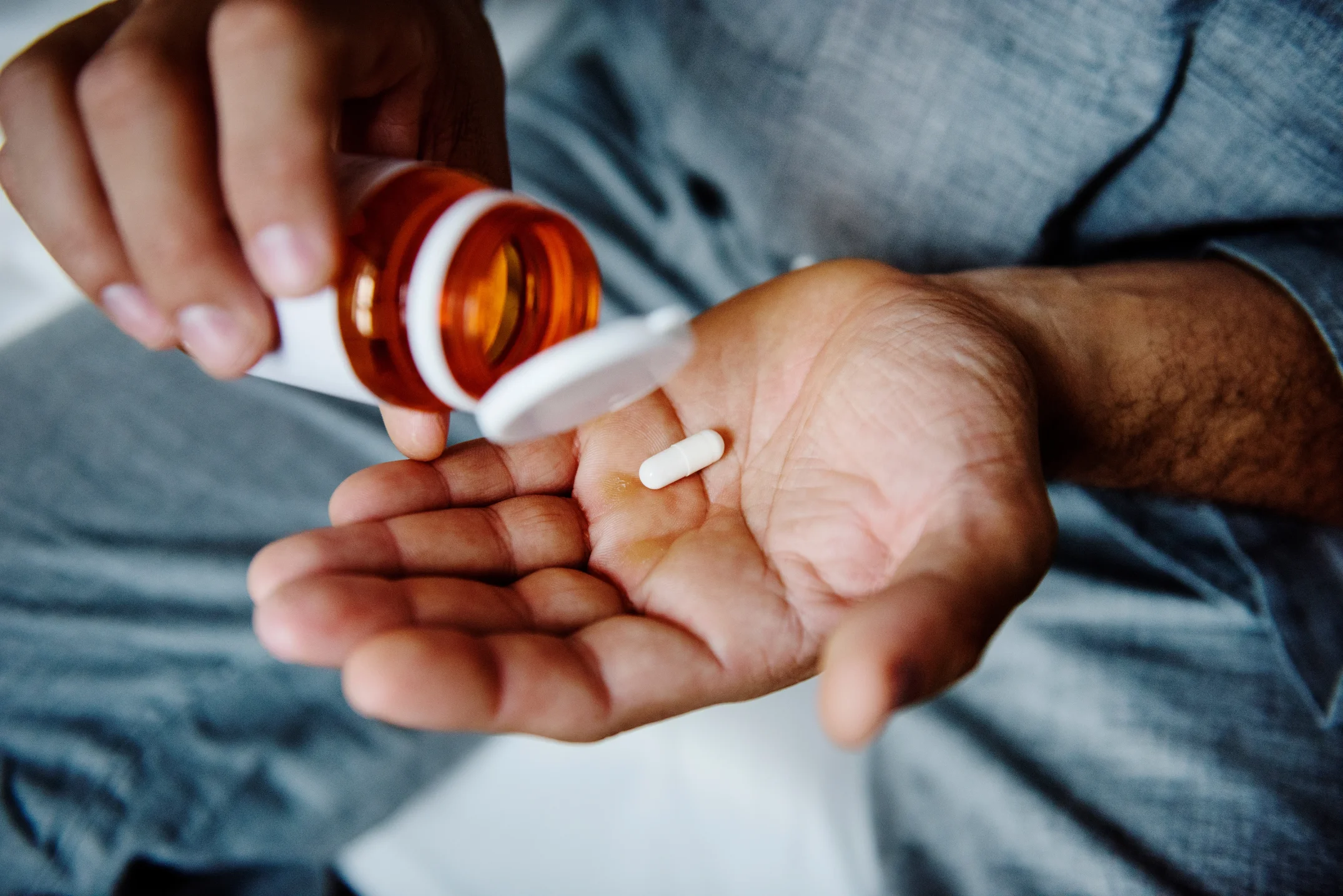 Man Taking Medication
