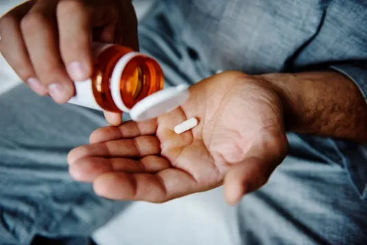 Man Taking Medication