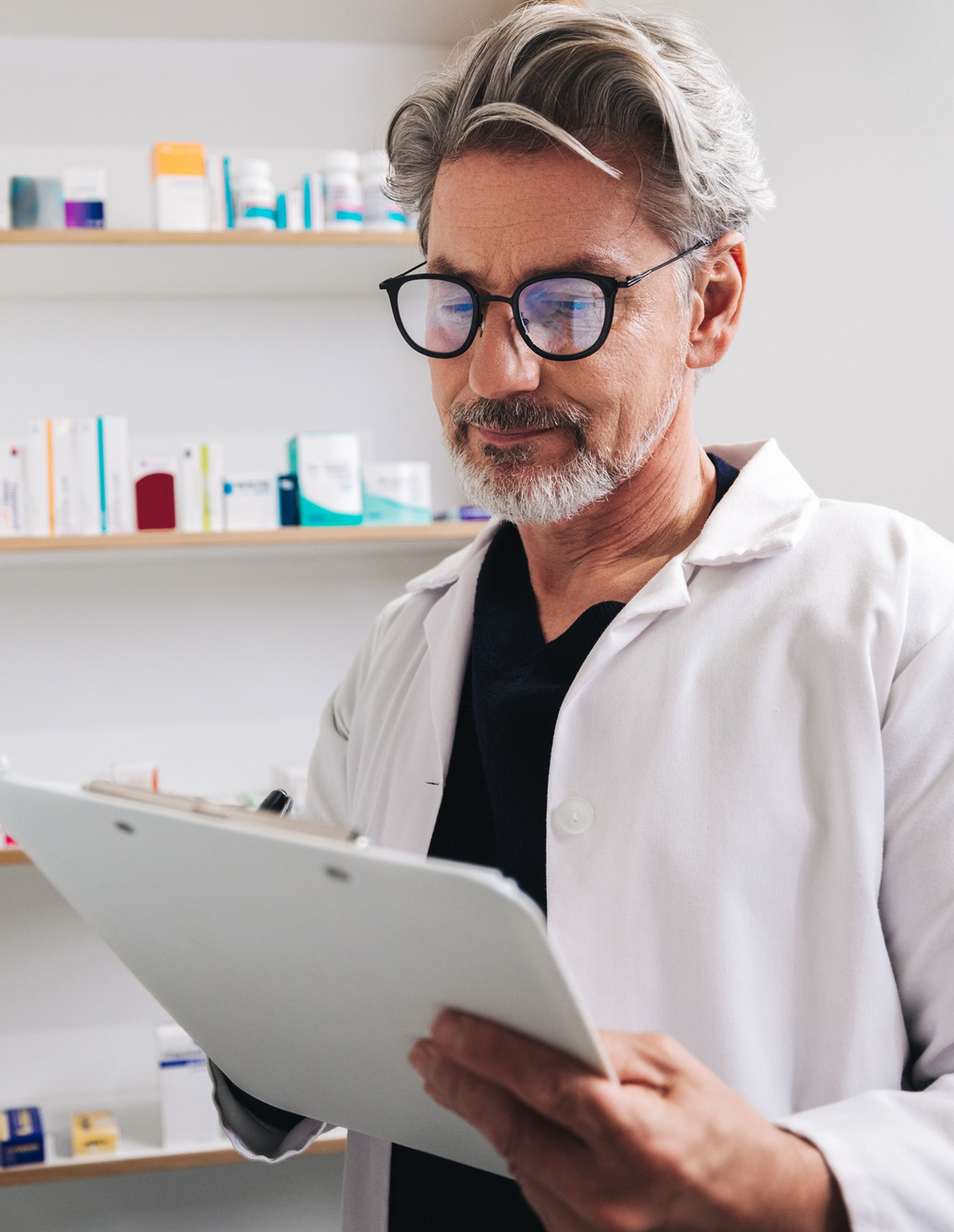 Medical professional looking at clipboard
