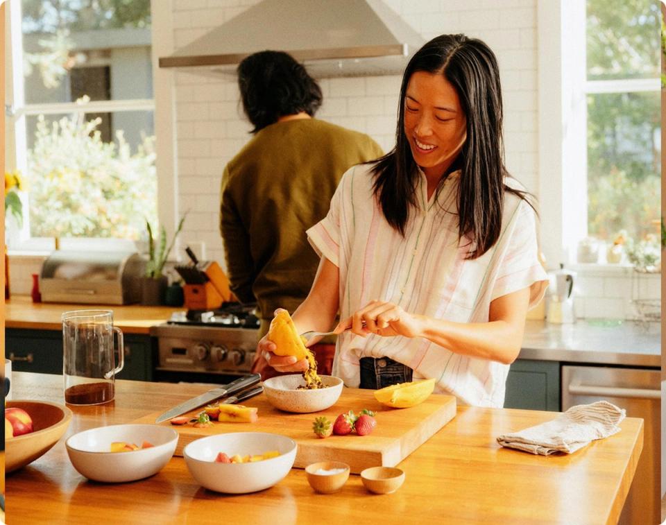 lady smiling in kitchen