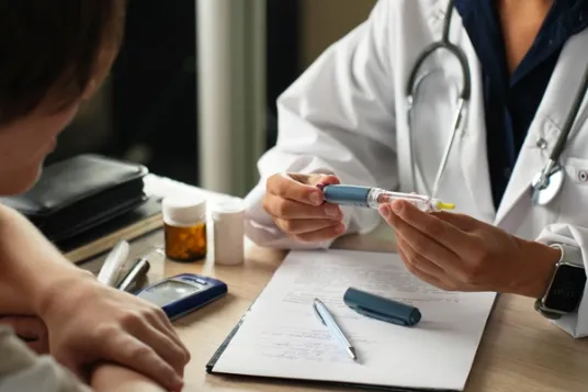 Doctor Explaining How to Use an Insulin Pen