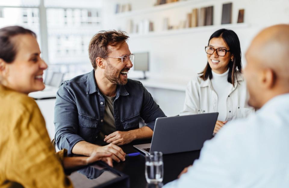 Coworkers smiling and working together