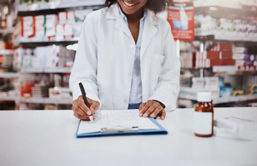 female pharmacist at pharmacy counter