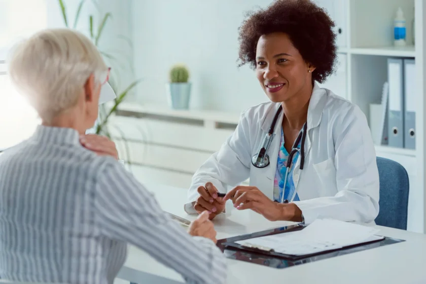 Female doctor talking to female patient