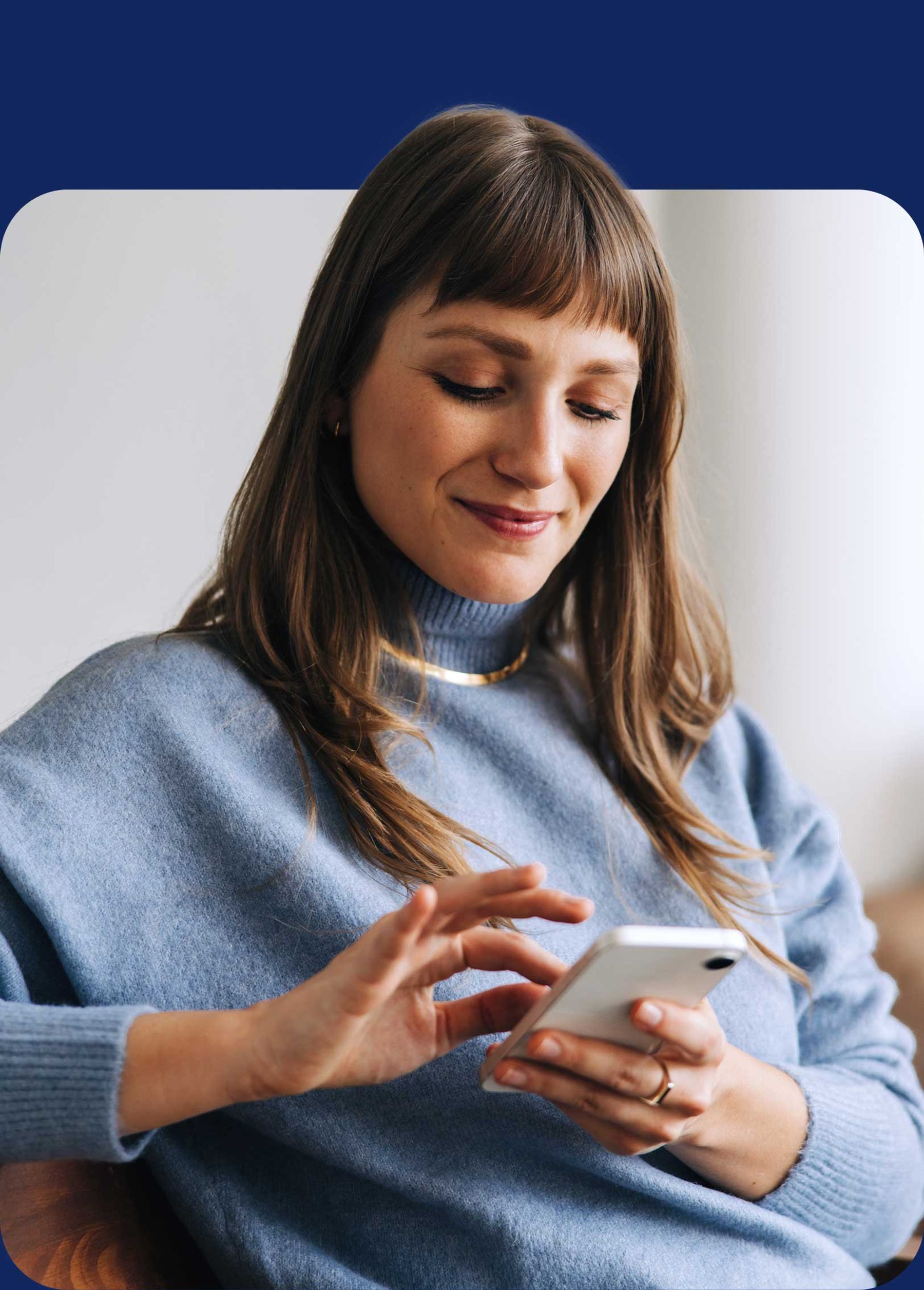 Woman sitting and using phone