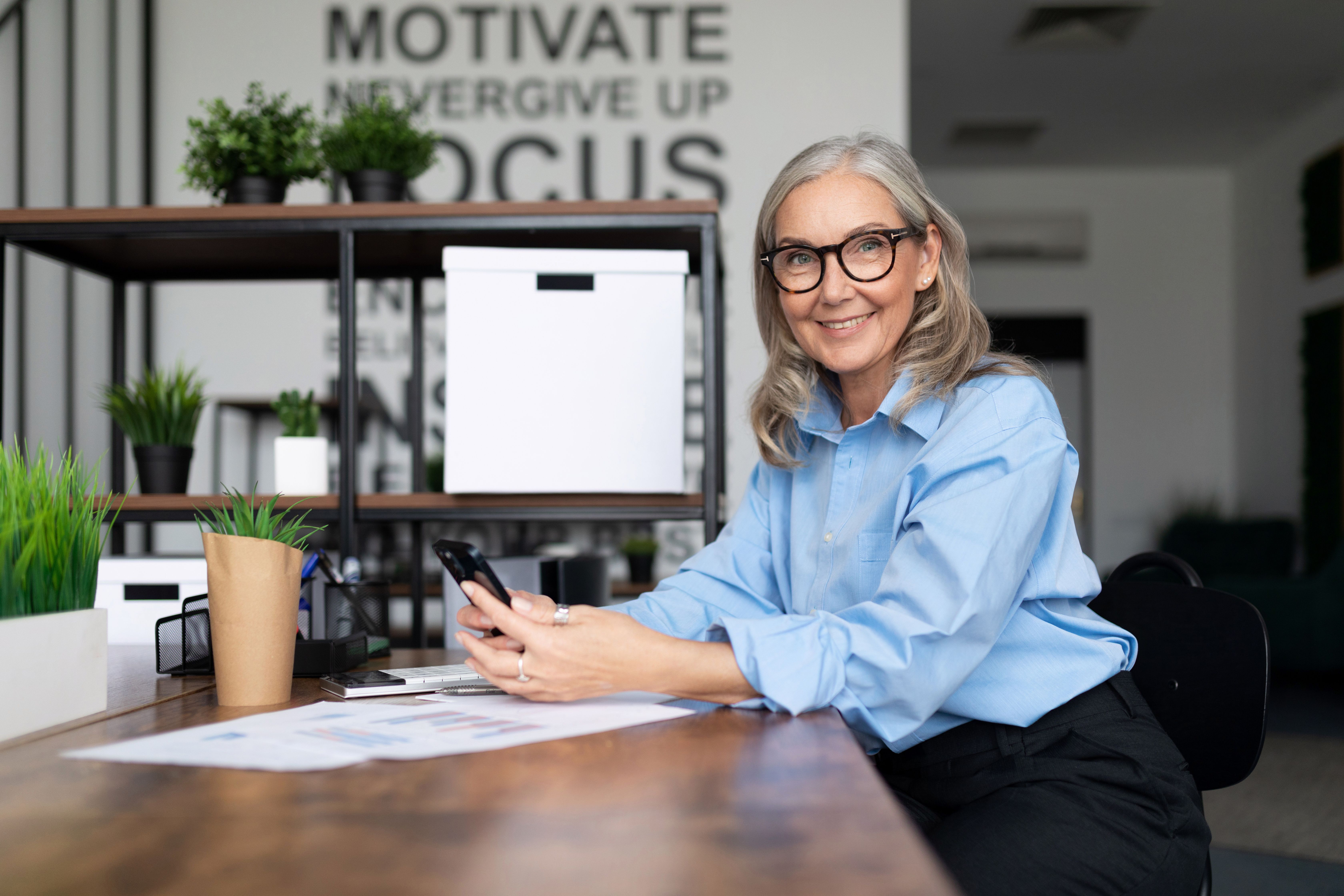 Woman sitting at desk in professional clothing