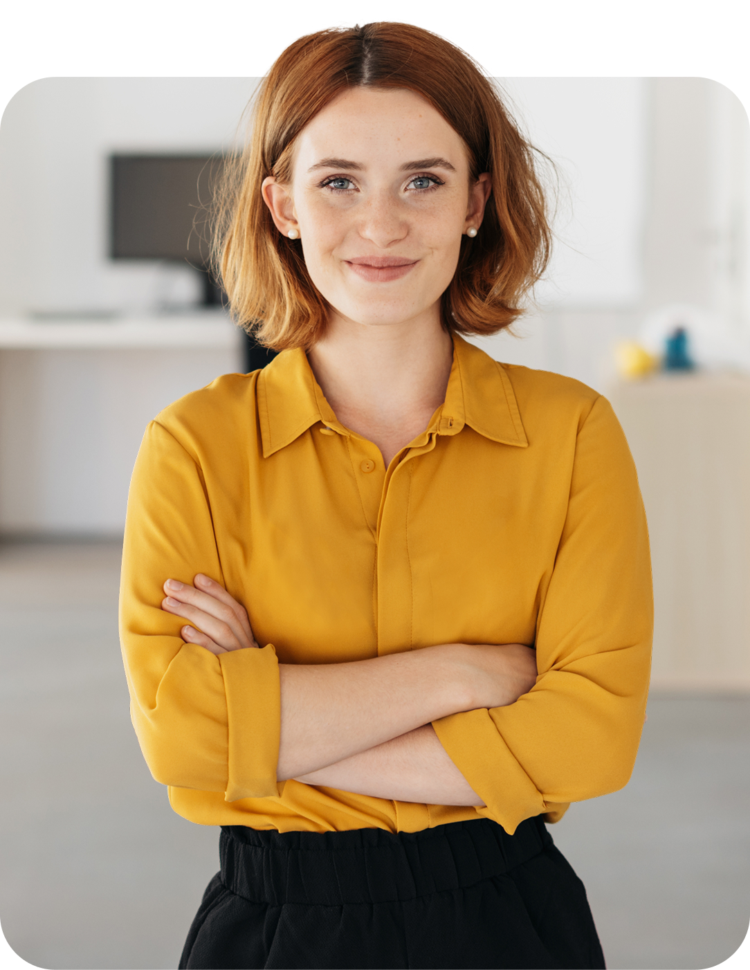 Smiling lady with yellow blouse and arms crossed