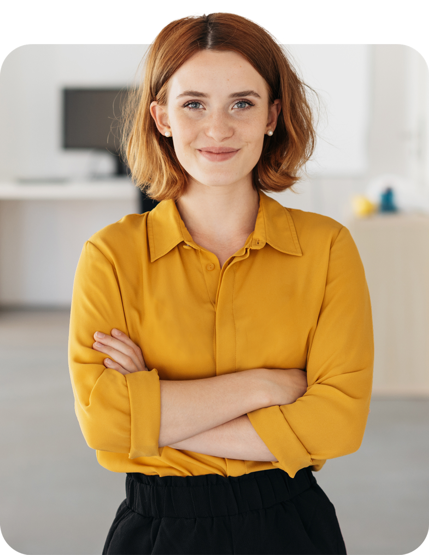 Smiling lady with yellow blouse and arms crossed