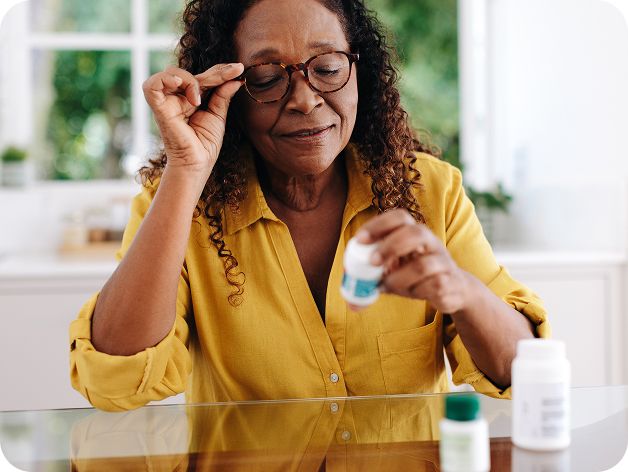 Woman looking at medication