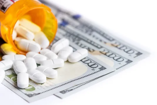 pills on top of money