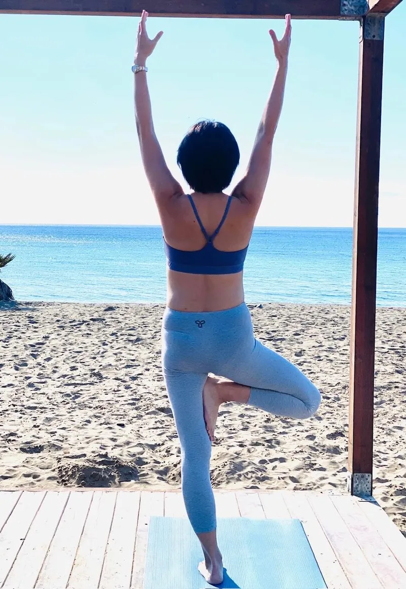 Fawn Glen doing Yoga at the beach