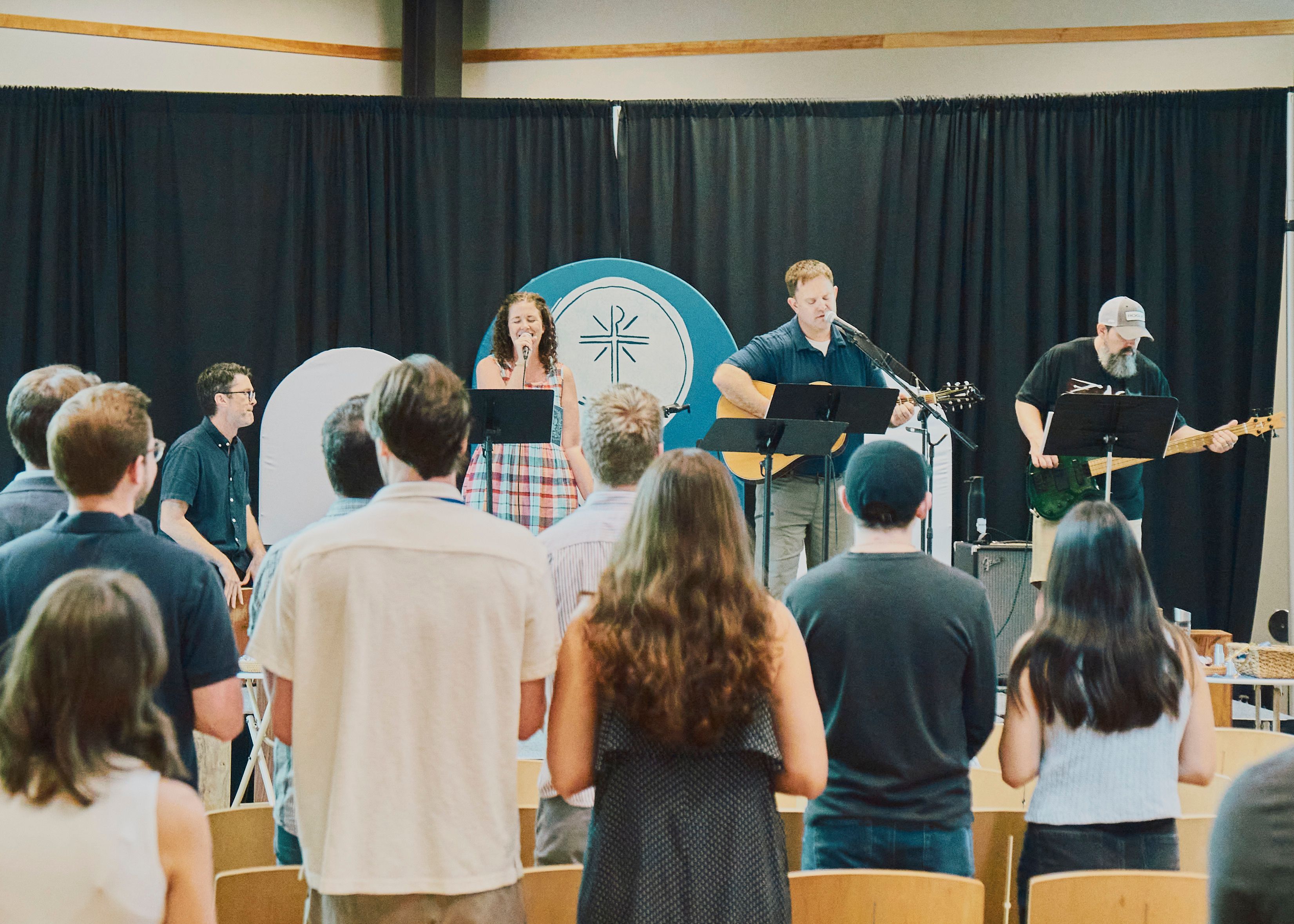 The Hope worship team leading Sunday morning worship with acoustic guitar and congregational singing.