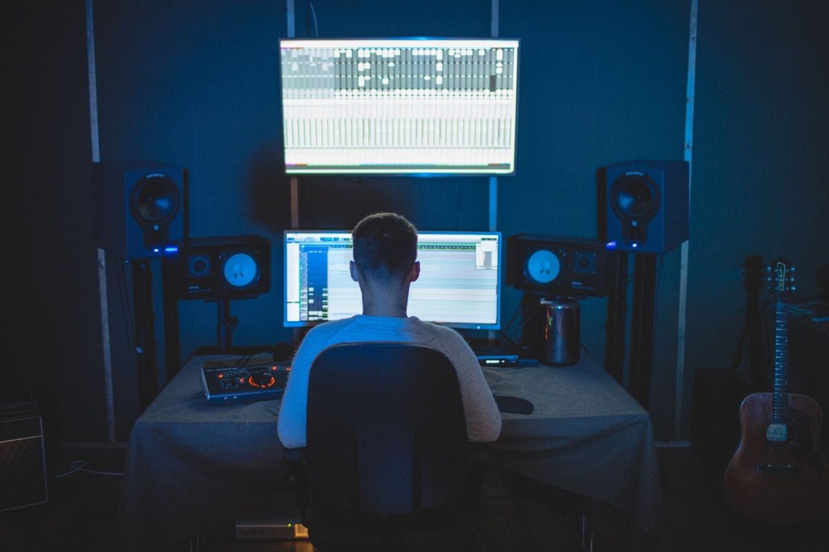 Music industry professional working on streaming platforms for musicians: strategies for amplifying your reach and impact