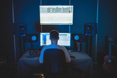 Music industry professional working on streaming platforms for musicians: strategies for amplifying your reach and impact