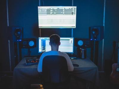Music industry professional working on streaming platforms for musicians: strategies for amplifying your reach and impact