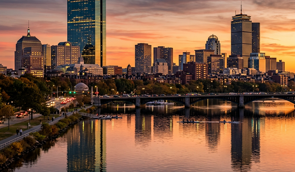 Boston Massachusetts skyline at dusk reflecting in Charles River