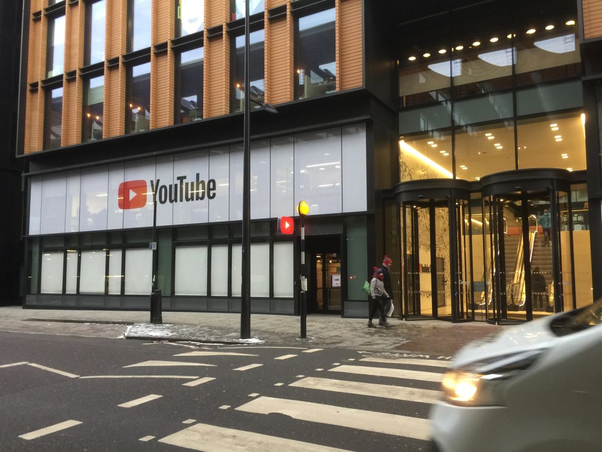 YouTube Space London at street level near King's Cross, with the red YouTube logo in the ground-floor windows and a revolving door at the entrance