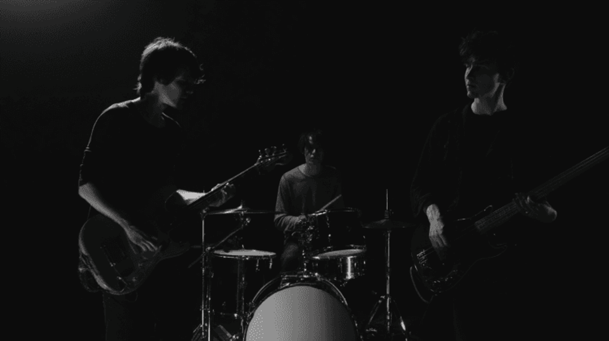 Dark stage with rock band performing live