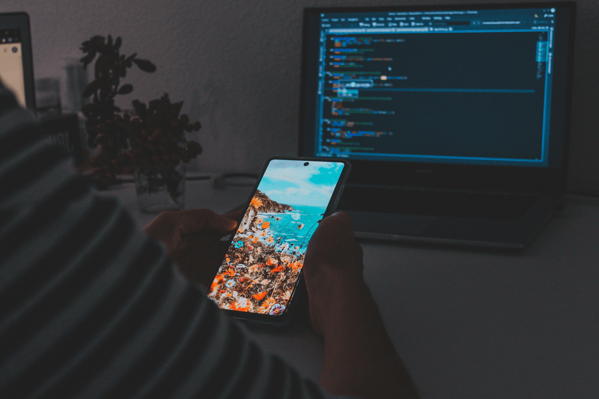 A person using their phone to promote their TikTok account