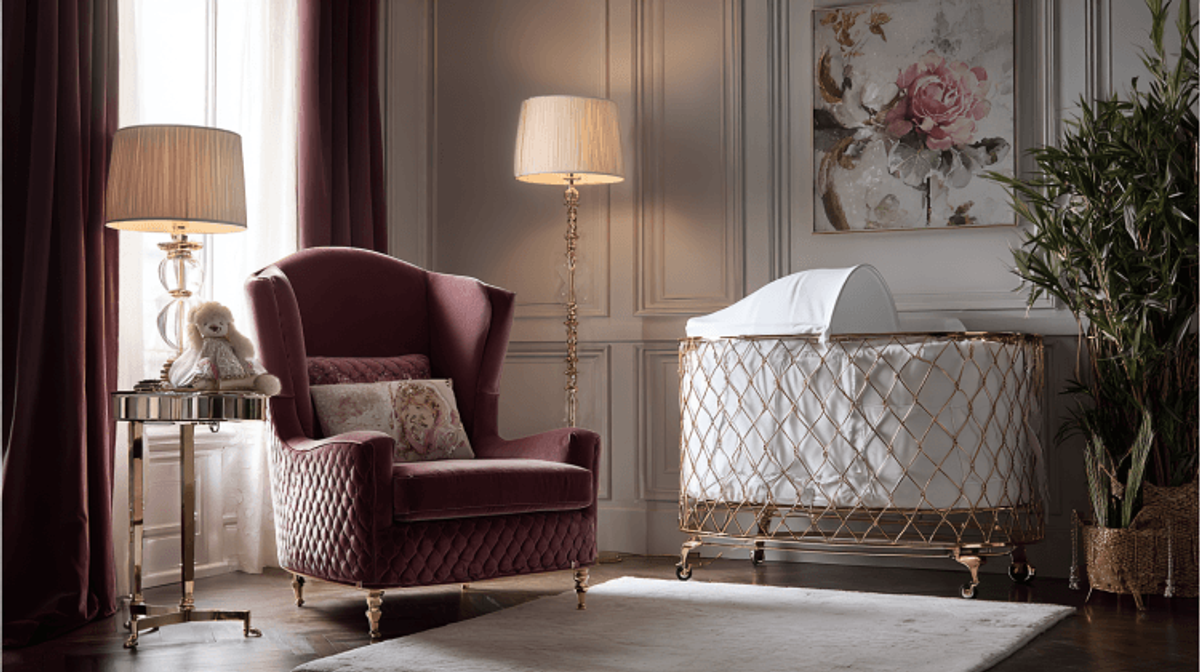 Luxurious nursery with crib, armchair, and decor.