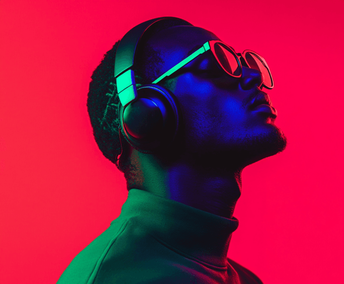 Person with headphones in colorful lighting