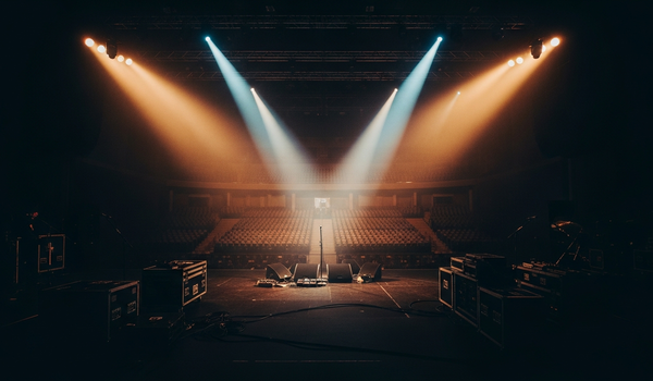 Entertainment marketing industry with dramatic stage lighting and production setup