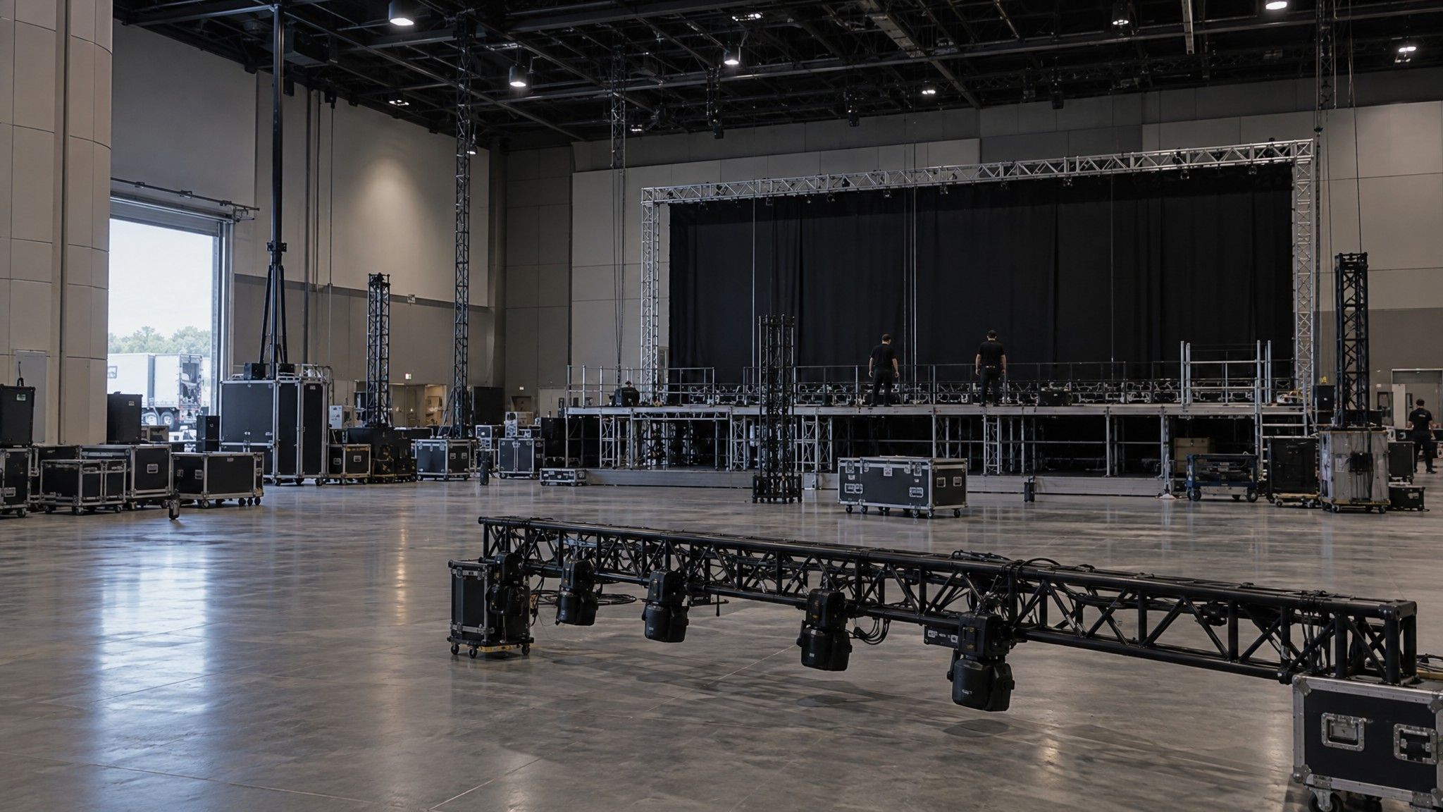 Conference hall during load-in with a half-built stage