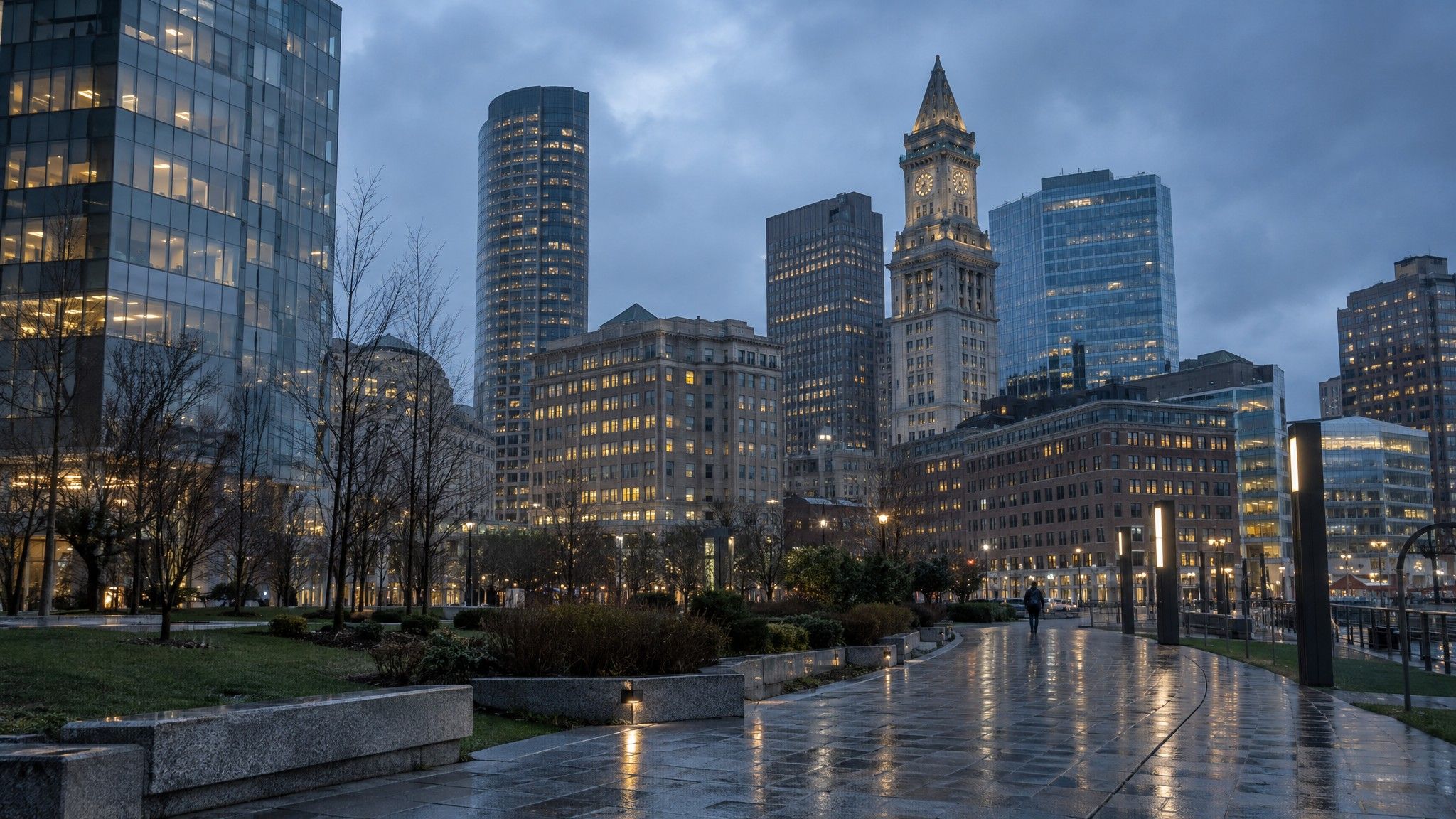 Boston Financial District towers at blue hour from the Greenway, wet paving