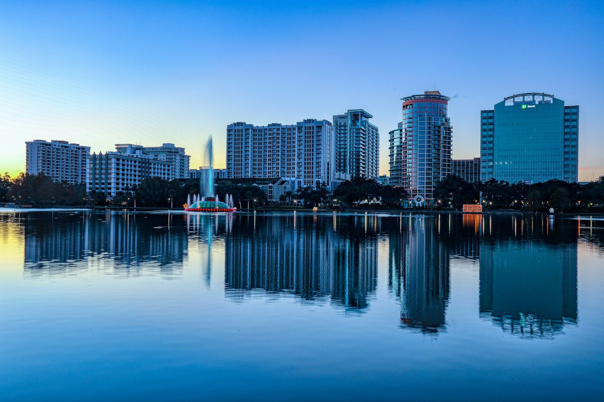 Downtown Orlando skyline reflected in Lake Eola — marketing services in Orlando