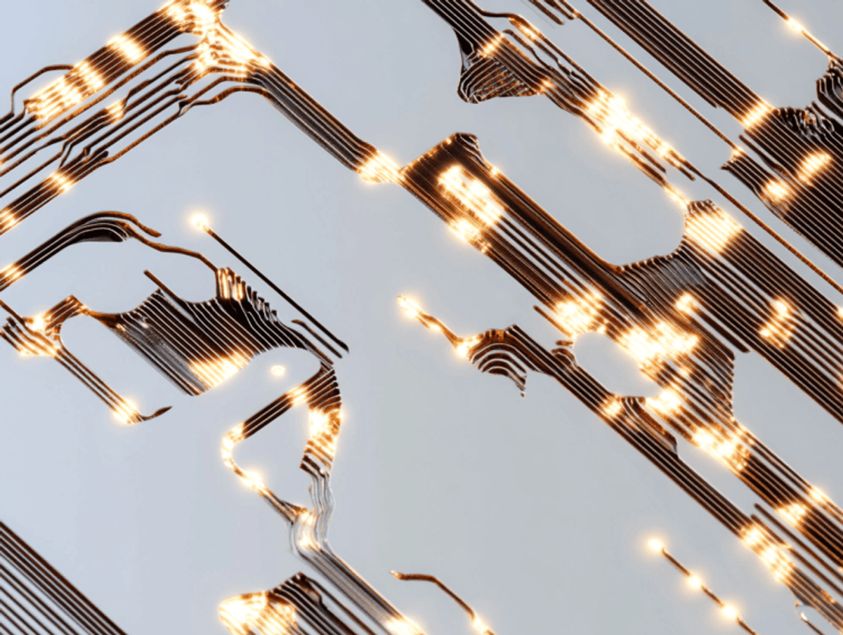 Close-up of illuminated circuit board traces.