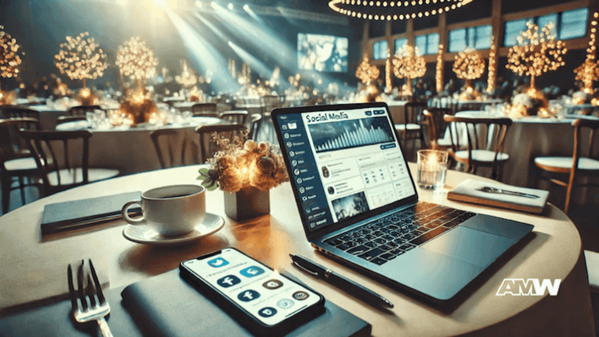 Laptop and smartphone on a wedding event table.