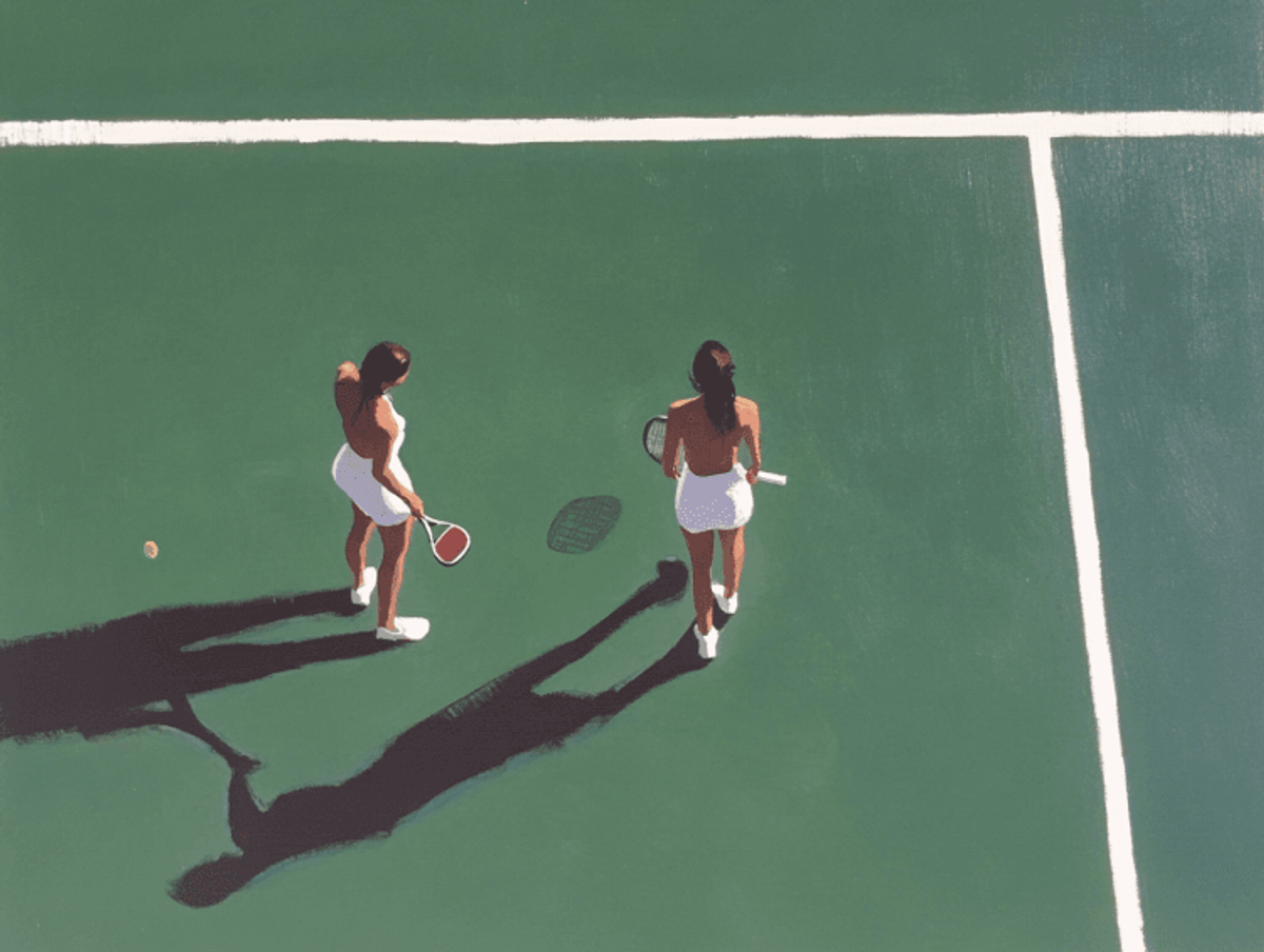 Two women on tennis court in shadow.