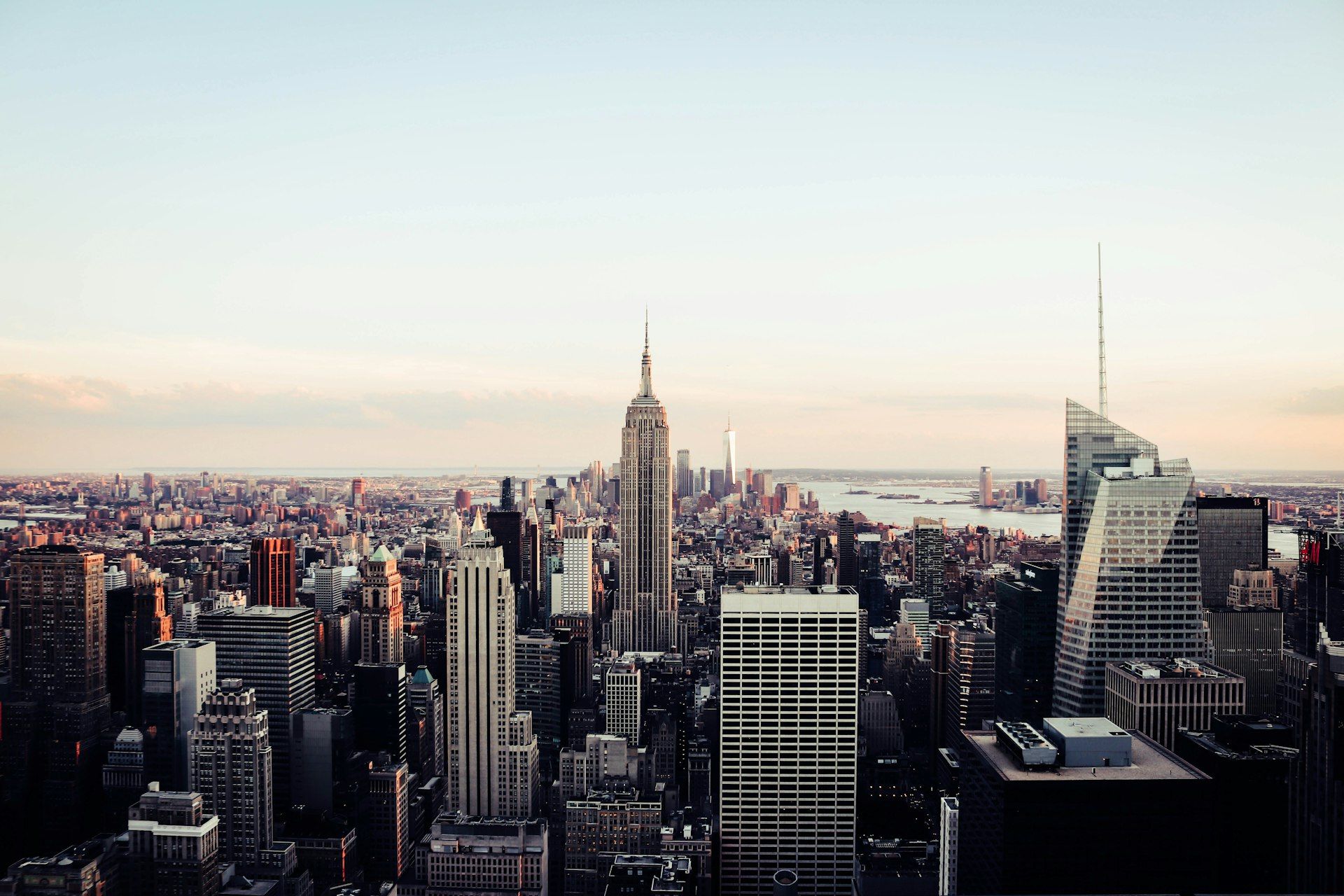 Manhattan skyline at sunset with Empire State Building illuminated for a corporate gala event