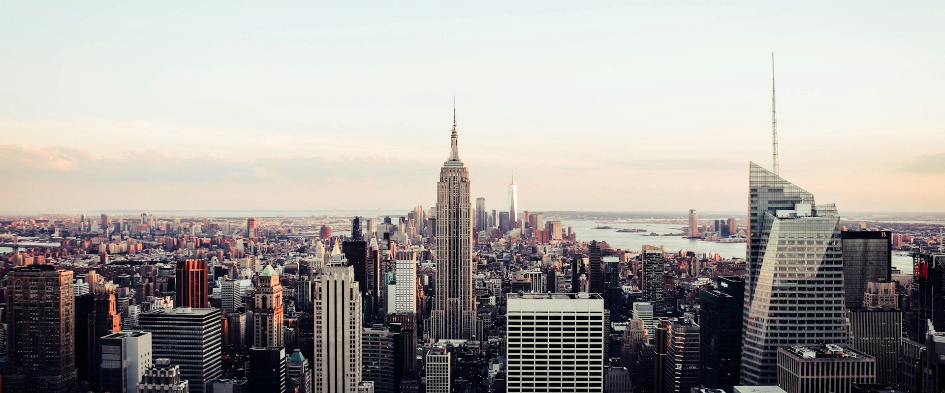 Manhattan skyline at sunset with Empire State Building illuminated for a corporate gala event
