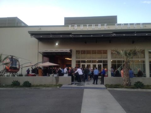The entrance of YouTube Space LA in 2014, with a crowd gathered on the patio under the YouTube Space lettering