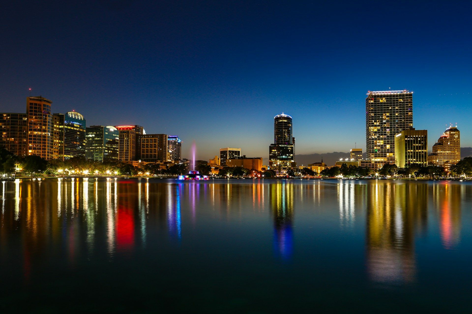 Downtown Orlando skyline at night across Lake Eola — marketing services in Orlando