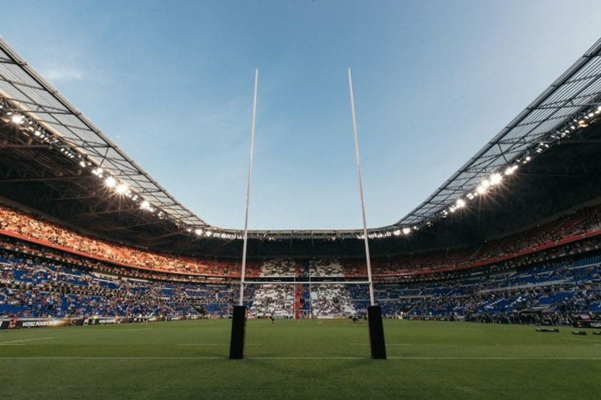 Rugby stadium with goal posts under clear sky