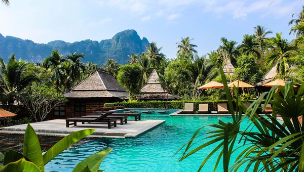 Tropical resort pool with cabanas for hospitality social media content