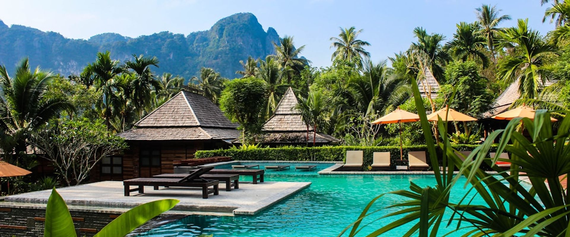 Tropical resort pool with cabanas for hospitality social media content