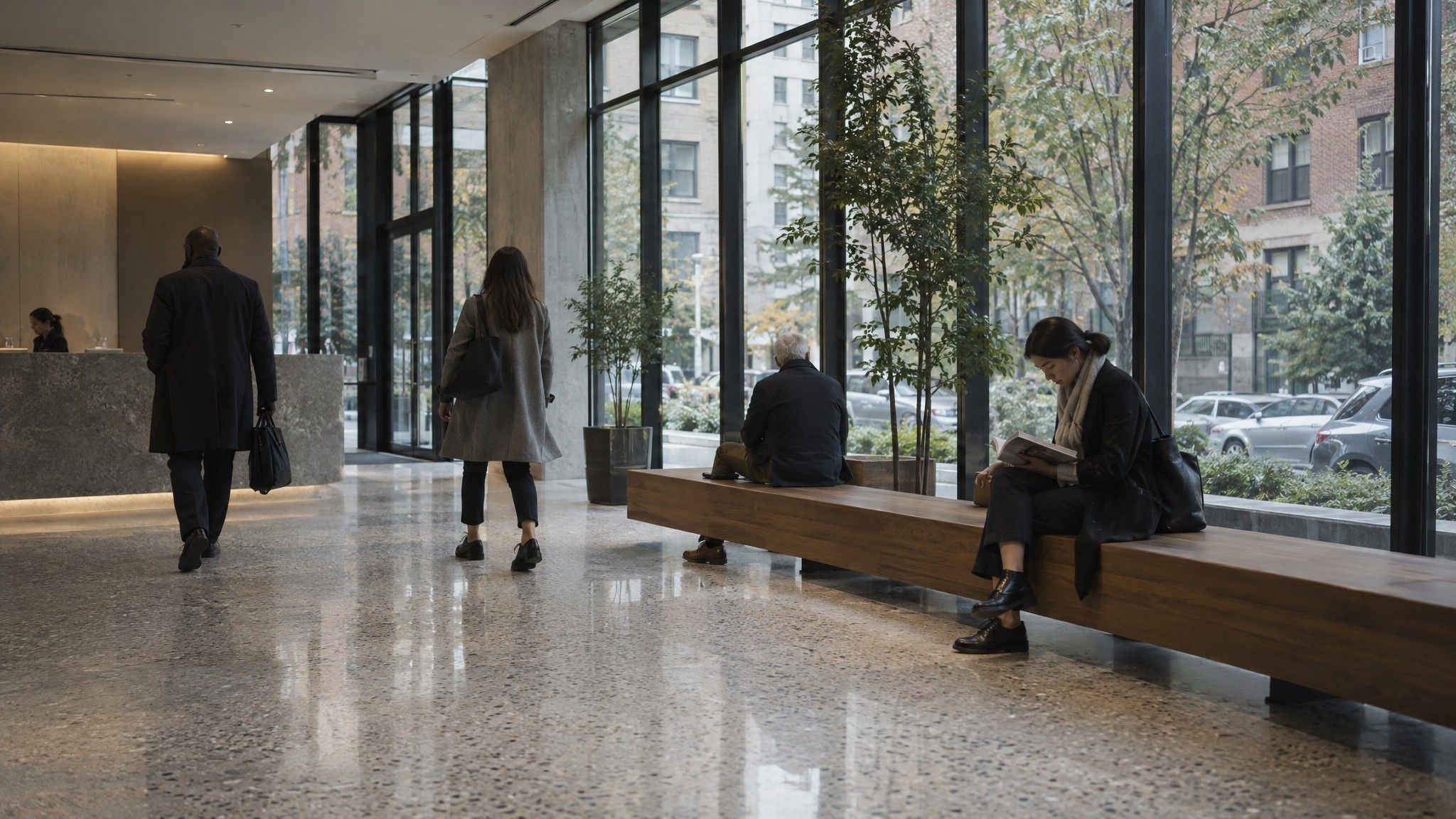 Apartment building lobby with terrazzo floor and a timber bench