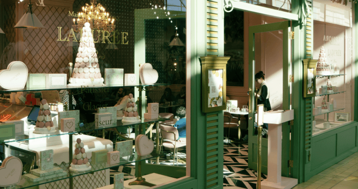 Elegant pastry shop interior with macarons display.