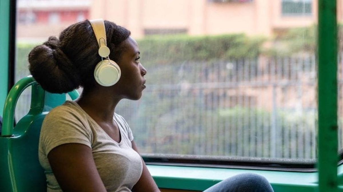 Person on train wearing headphones
