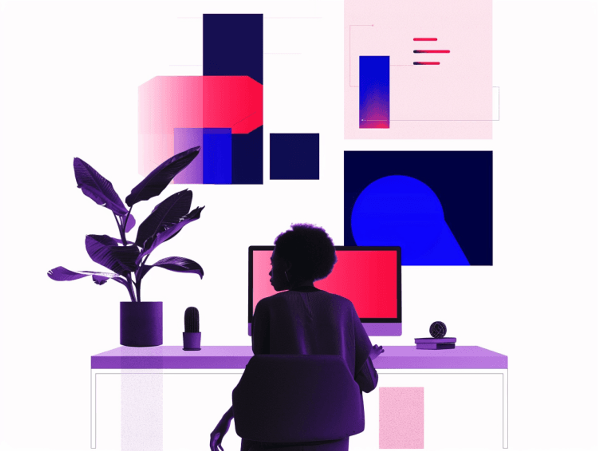 Person working at desk with computer and plants.