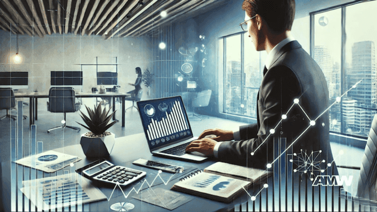 Businessman analyzing data on laptop in modern office.