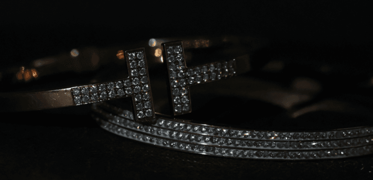 Elegant diamond-studded bangles on dark background