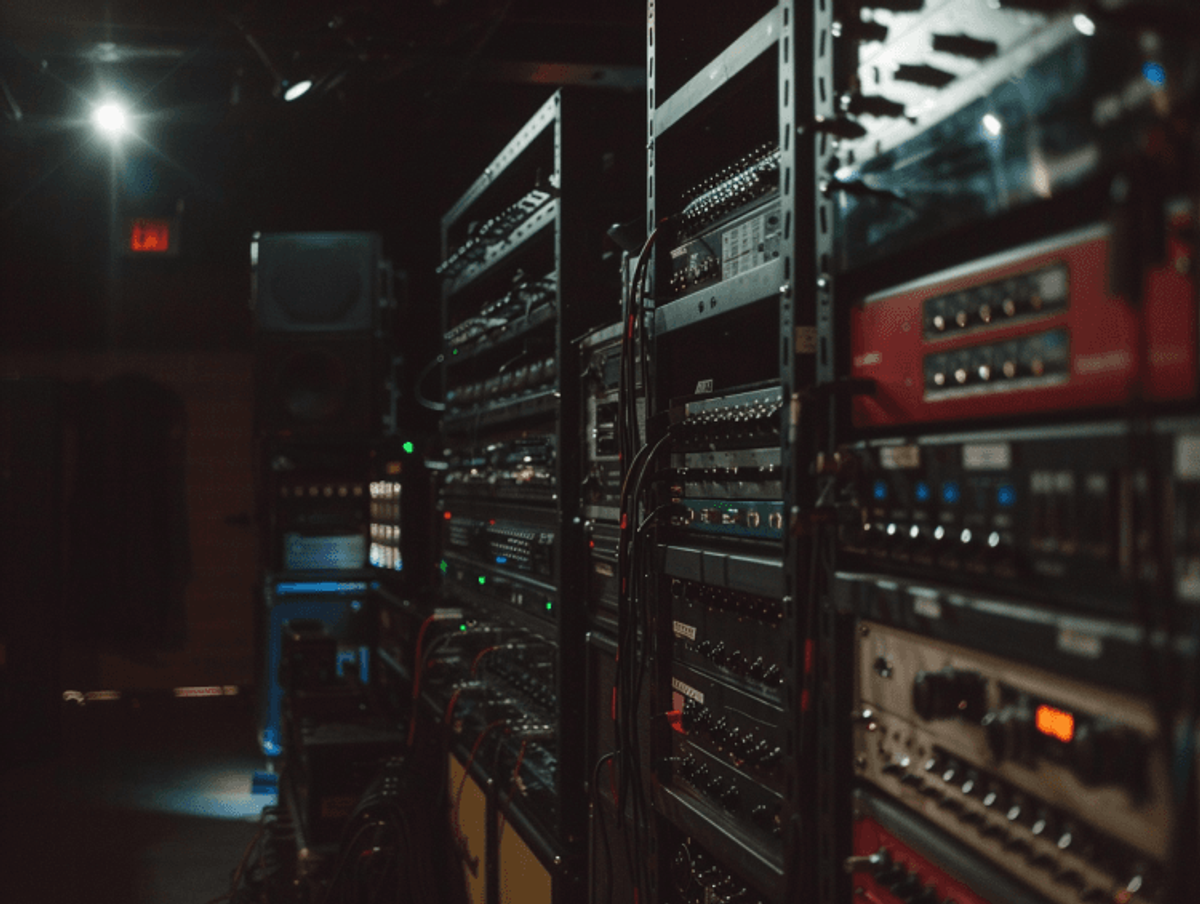 Dimly lit server room with electronic racks