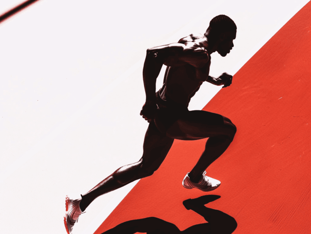 Athlete sprinting on red track with dynamic pose.